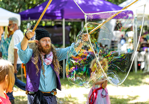 Performer making a very large bubble